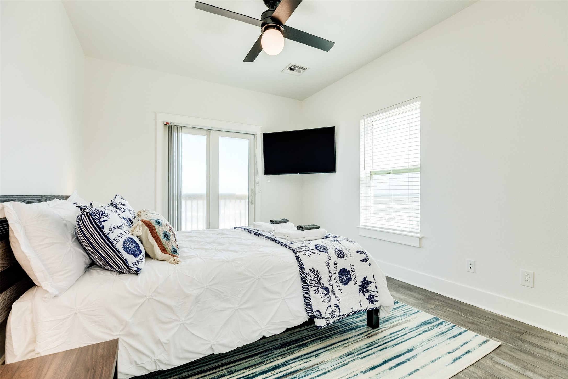 109 D Santar Loop Surfside Beach, TX 77541 - Photo 26 of 42 a bedroom with a bed and a window