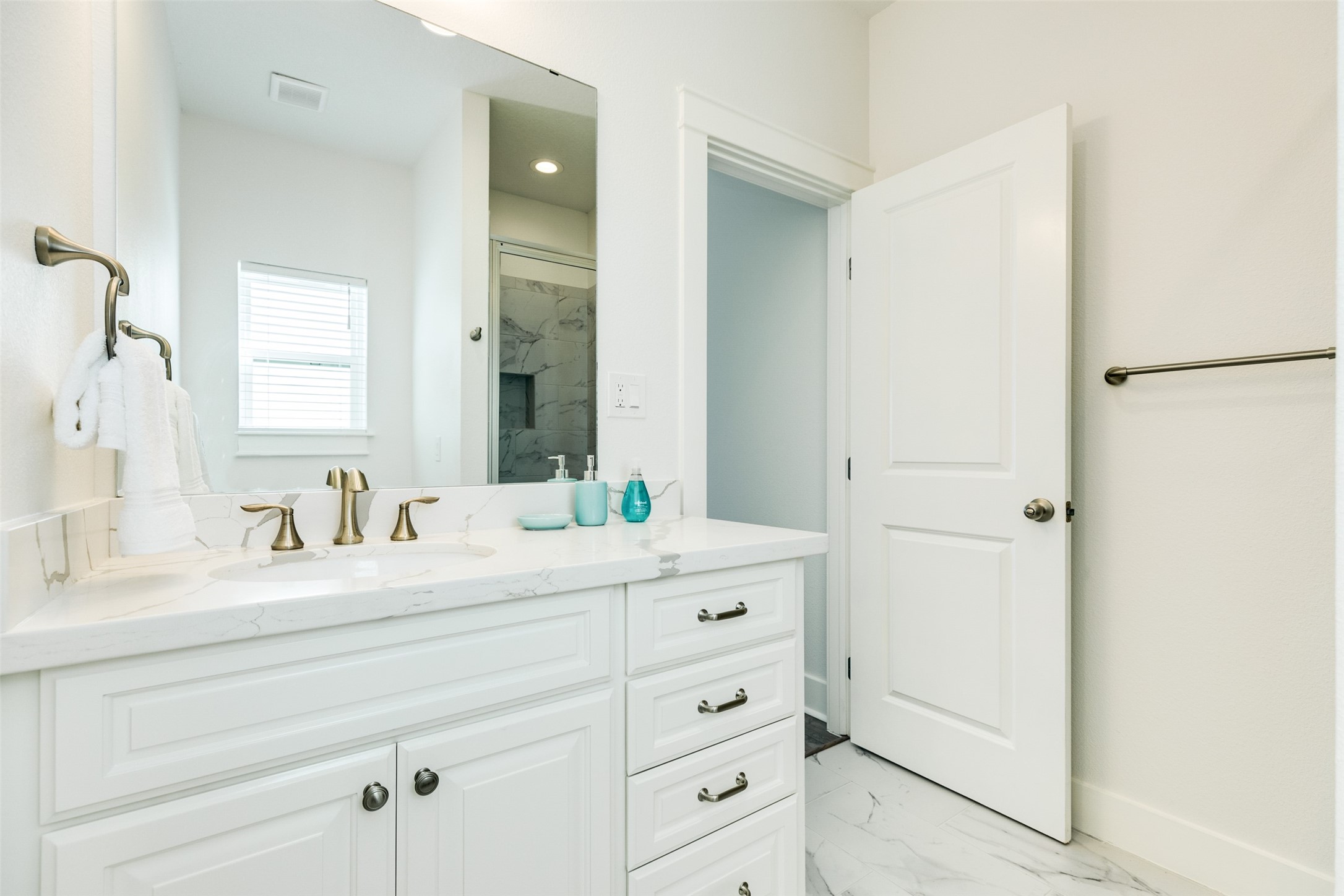 109 D Santar Loop Surfside Beach, TX 77541 - Photo 27 of 42 a bathroom with a sink and a mirror