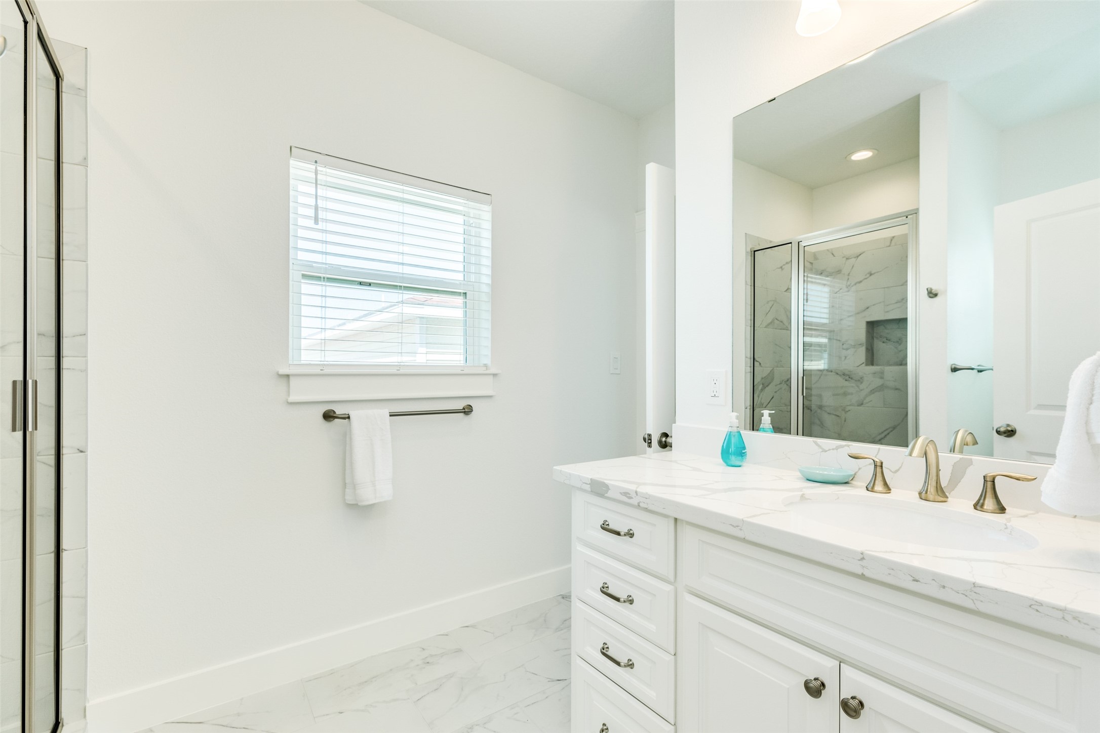 109 D Santar Loop Surfside Beach, TX 77541 - Photo 30 of 42 a bathroom with a sink and a mirror