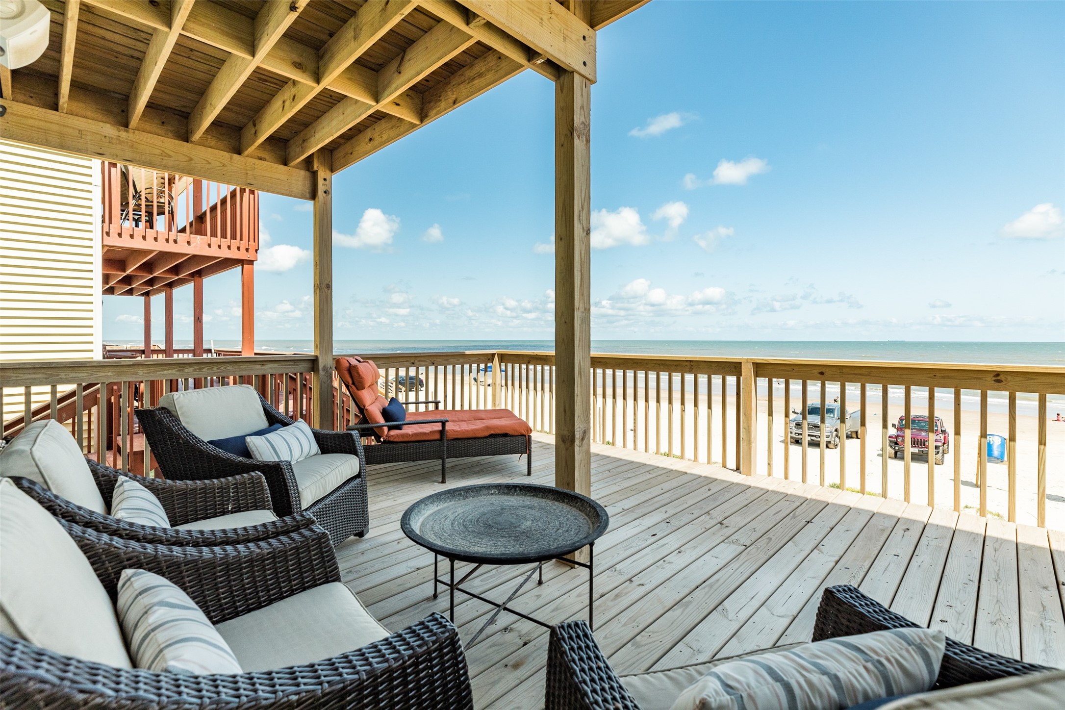 109 D Santar Loop Surfside Beach, TX 77541 - Photo 3 of 42 a balcony with wooden floor and outdoor seating
