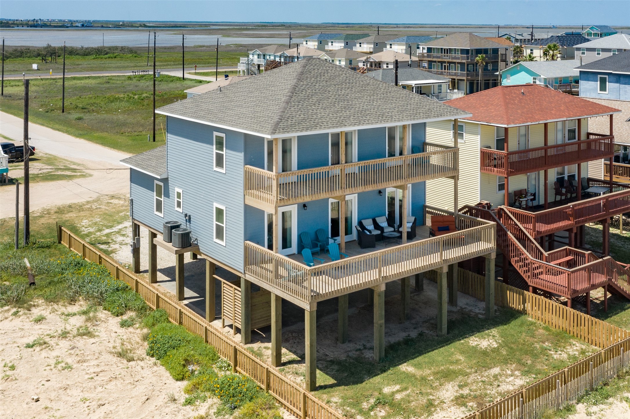 109 D Santar Loop Surfside Beach, TX 77541 - Photo 32 of 42 a aerial view of a house with a yard