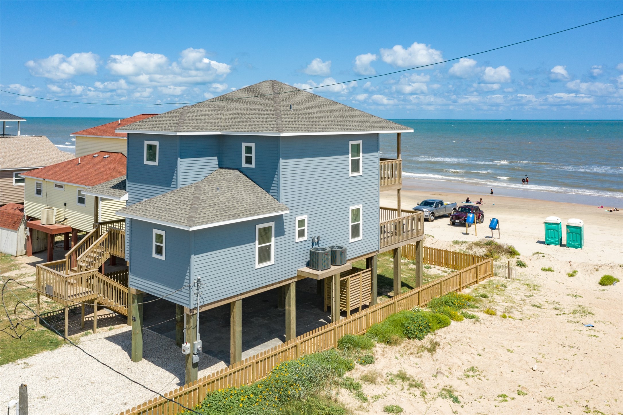 109 D Santar Loop Surfside Beach, TX 77541 - Photo 33 of 42 a aerial view of a house with a yard and balcony