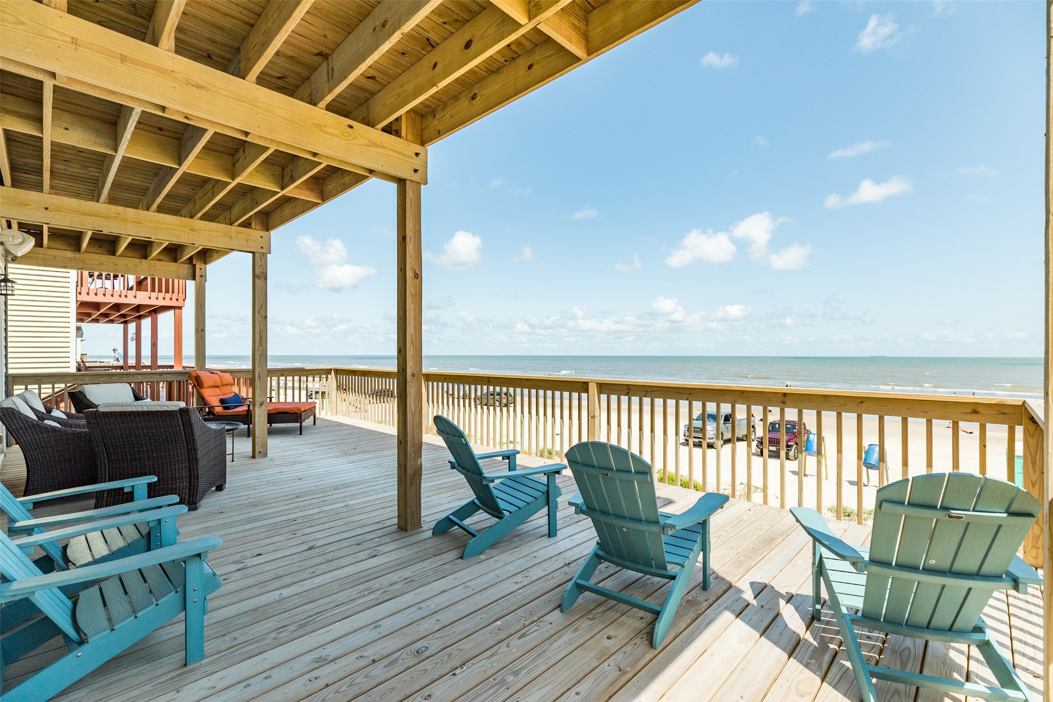 109 D Santar Loop Surfside Beach, TX 77541 - Photo 6 of 42 a balcony with furniture and wooden floor