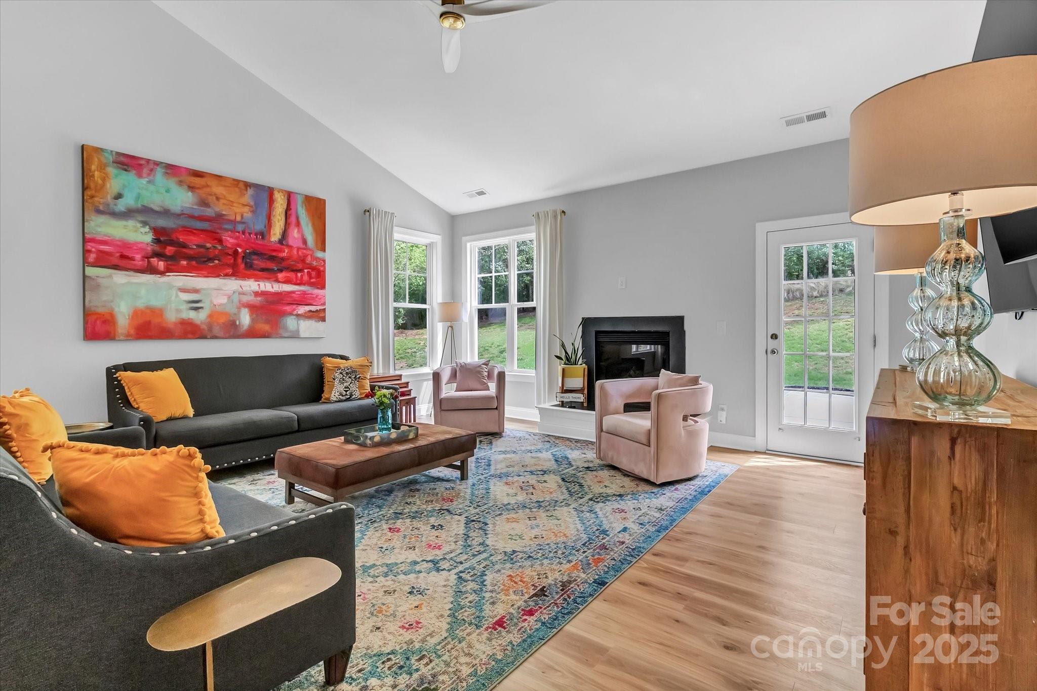 835 Ryans Place Fort Mill, SC 29715 - Photo 11 of 37 a living room with furniture fireplace and a flat screen tv