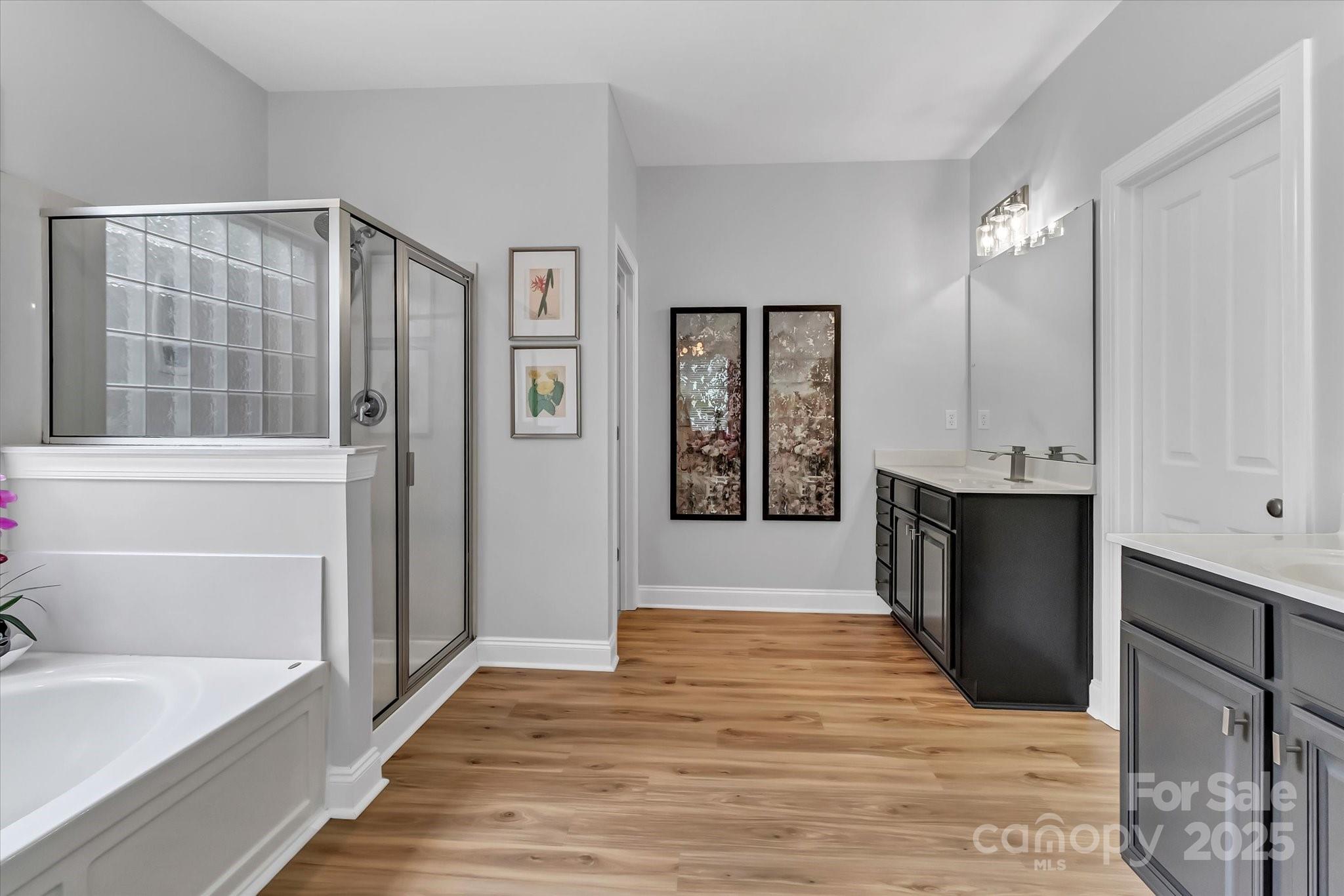 835 Ryans Place Fort Mill, SC 29715 - Photo 17 of 37 a bathroom with a tub shower and sink