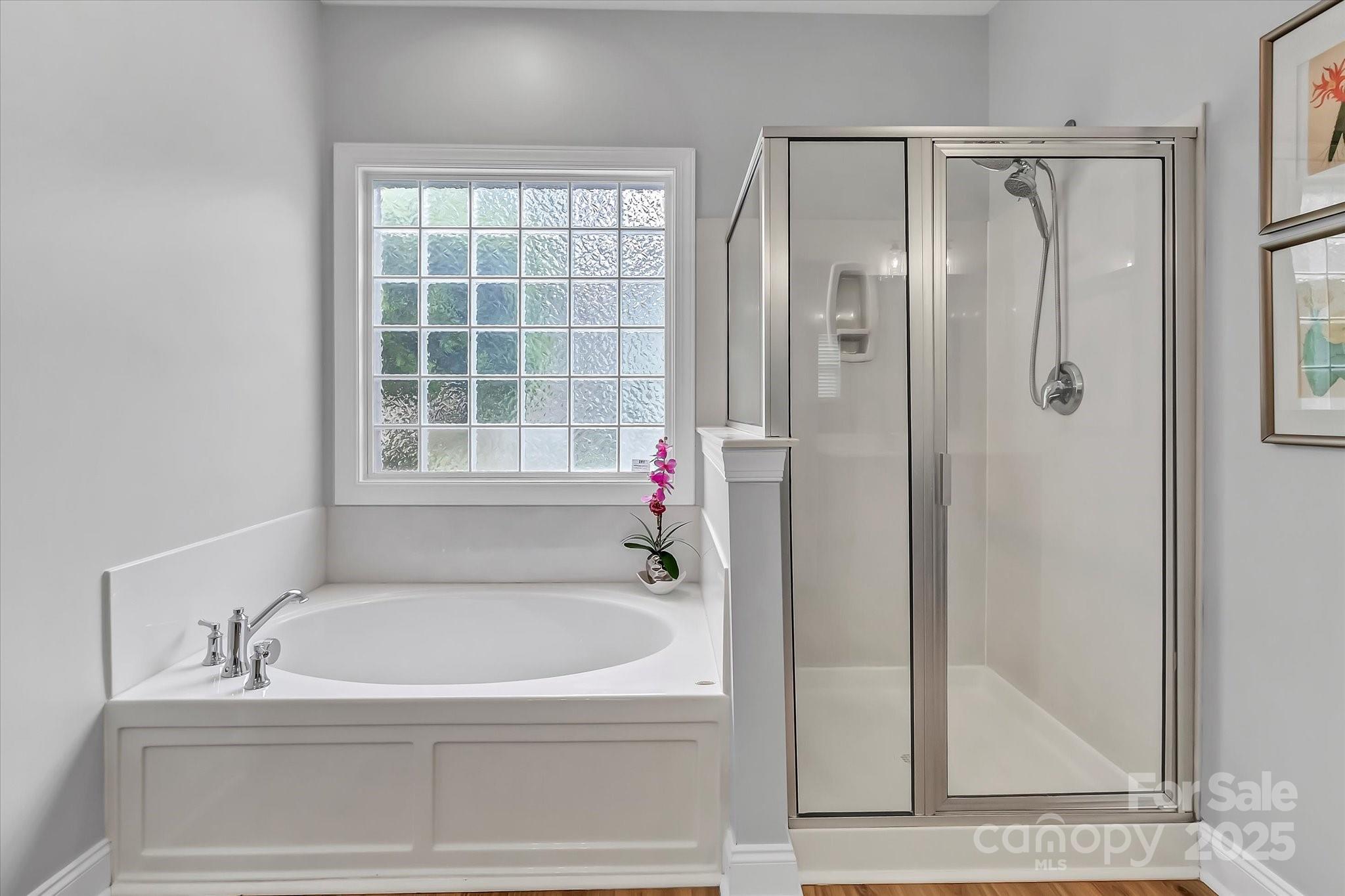 835 Ryans Place Fort Mill, SC 29715 - Photo 18 of 37 a bathroom with a tub and a shower
