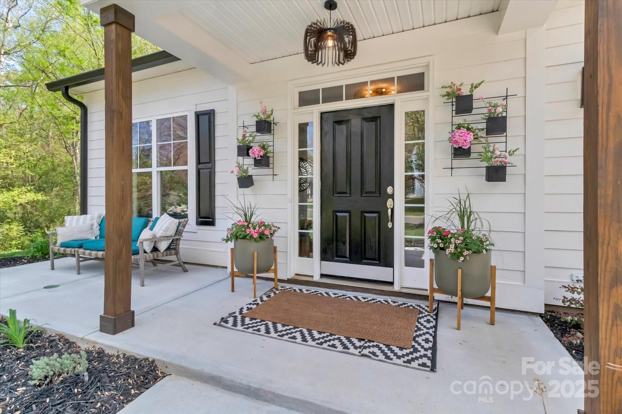 835 Ryans Place Fort Mill, SC 29715 - Photo 2 of 37 a front view of a house with outdoor seating