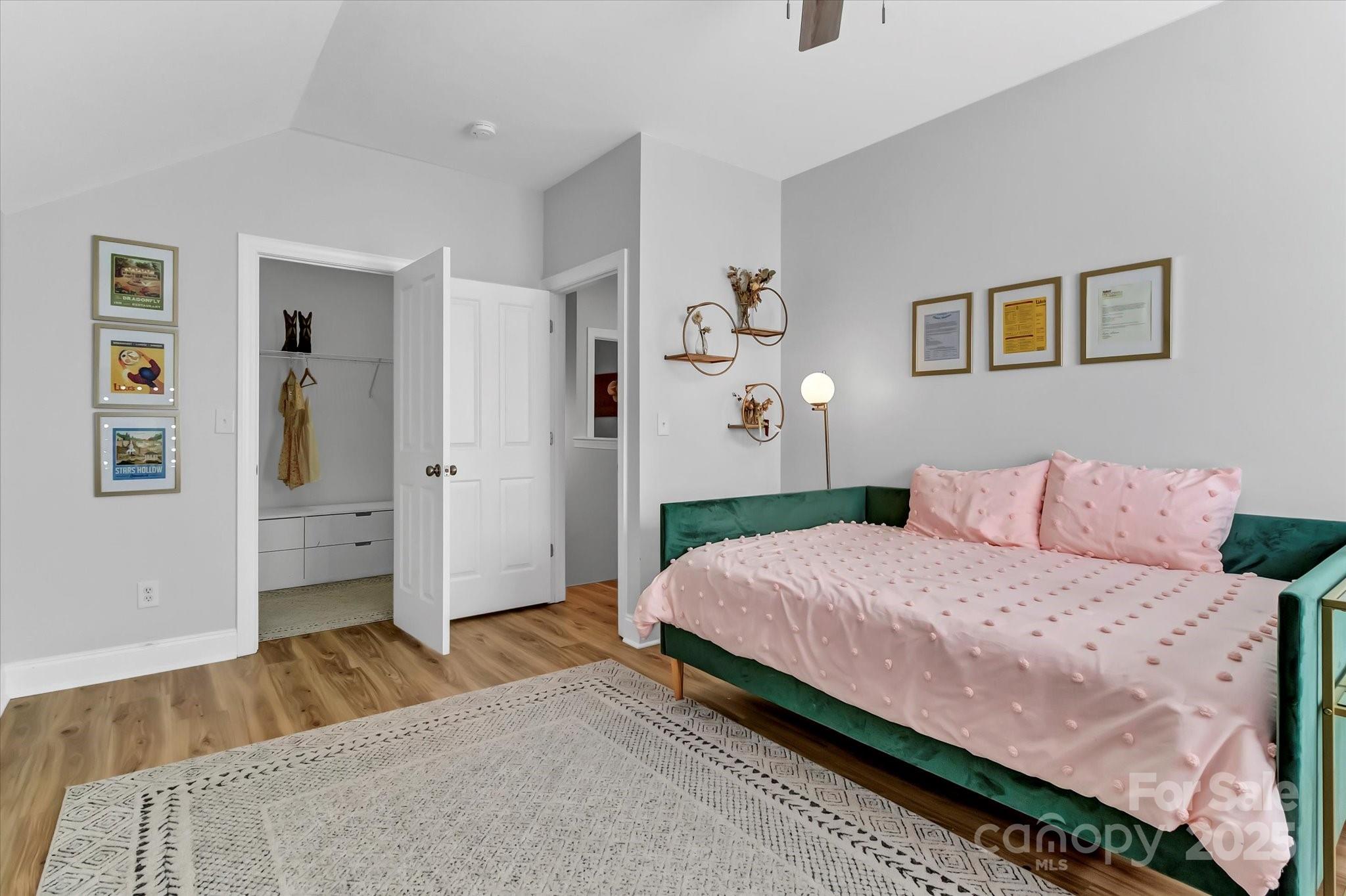 835 Ryans Place Fort Mill, SC 29715 - Photo 25 of 37 a bedroom with a bed and painting on the wall