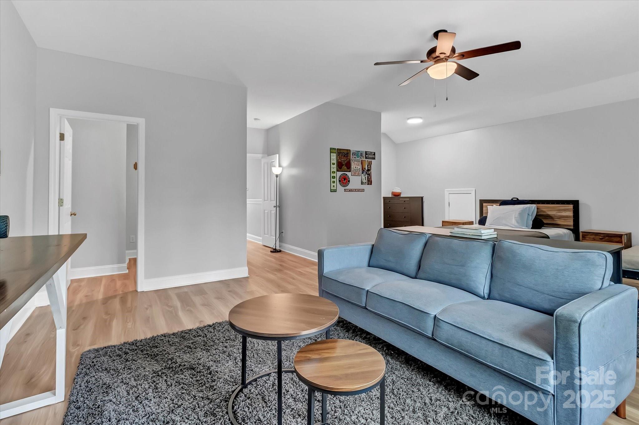 835 Ryans Place Fort Mill, SC 29715 - Photo 32 of 37 a living room with furniture and a wooden floor