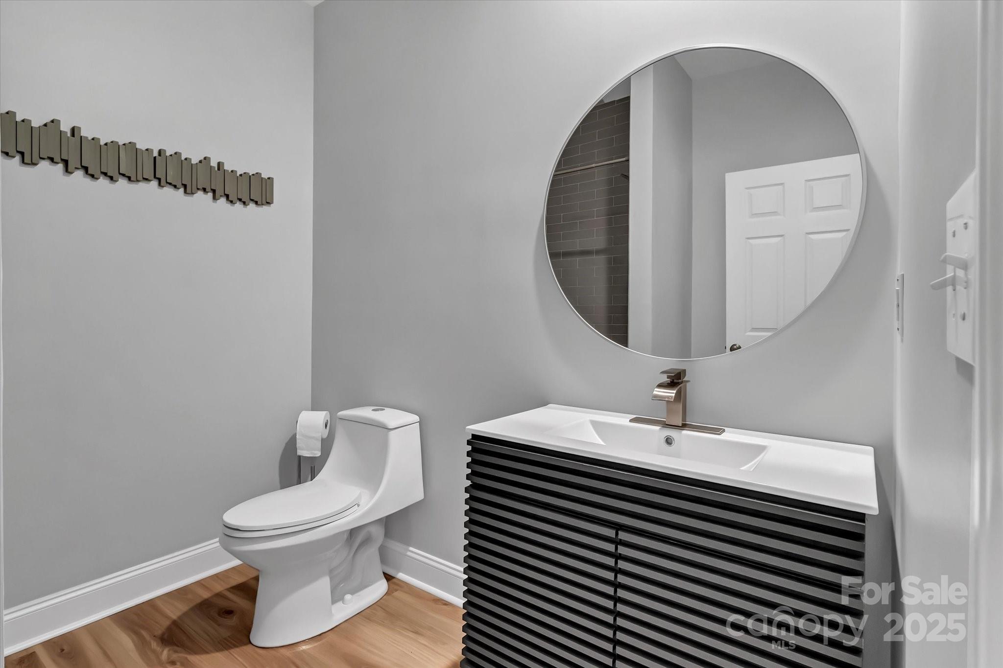 835 Ryans Place Fort Mill, SC 29715 - Photo 33 of 37 a bathroom with a toilet sink and mirror