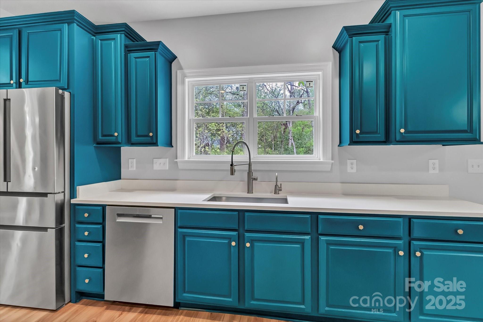 835 Ryans Place Fort Mill, SC 29715 - Photo 9 of 37 a kitchen with a sink and a refrigerator