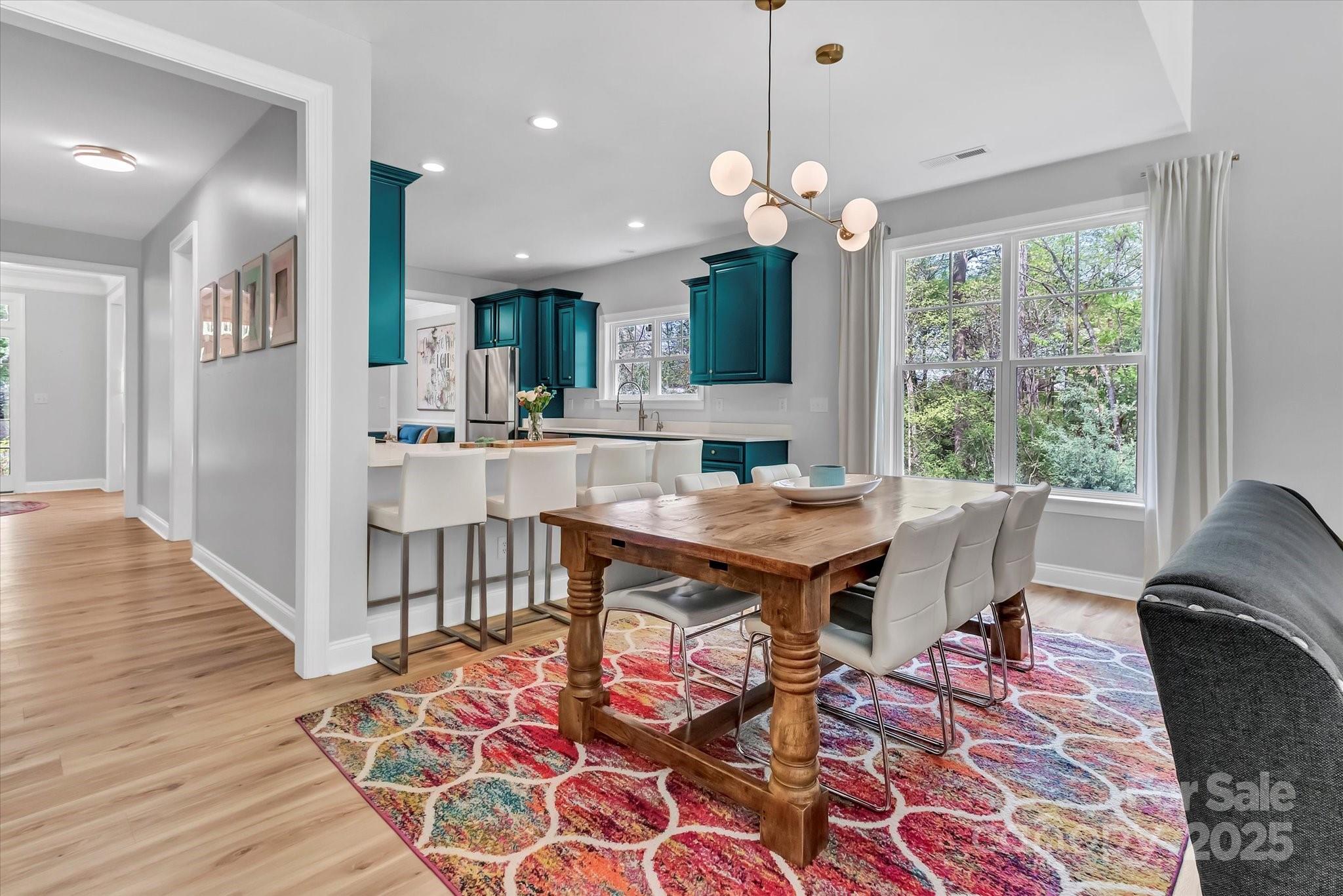 835 Ryans Place Fort Mill, SC 29715 - Photo 10 of 37 a view of a dining room with furniture and wooden floor