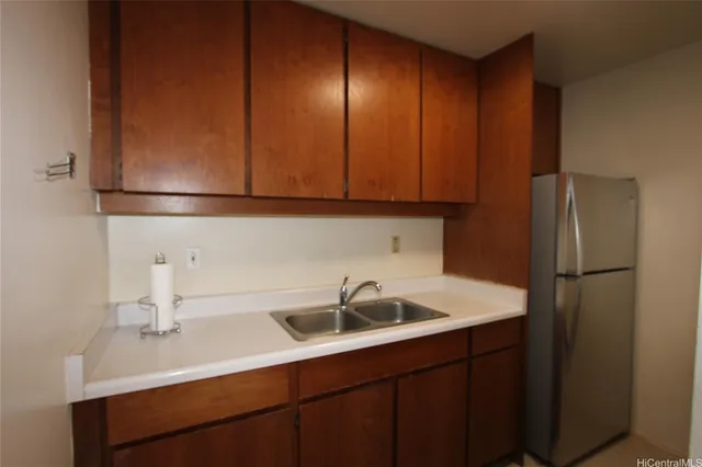 a kitchen with stainless steel appliances granite countertop a stove and a refrigerator