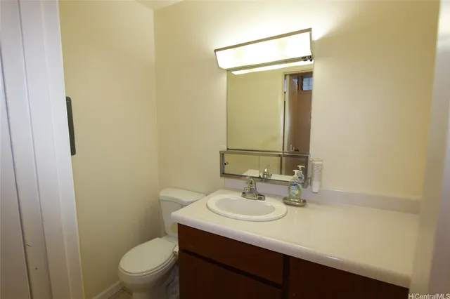 wooden floor in an empty room with a staircase