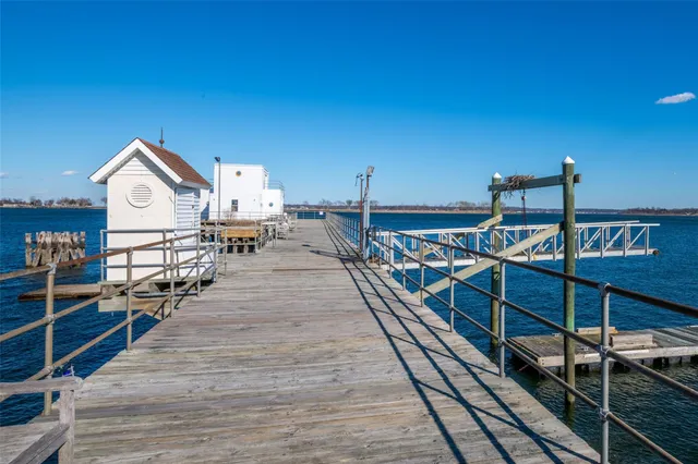 a view of a house with a small yard and plants