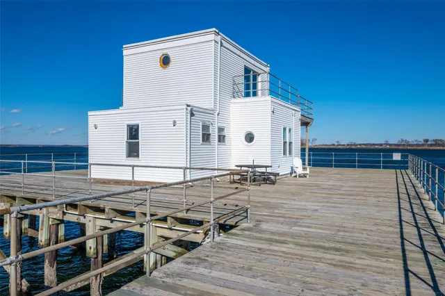 a view of a balcony with two chairs