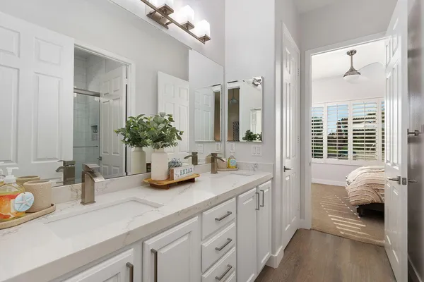 a bathroom with sink and mirror