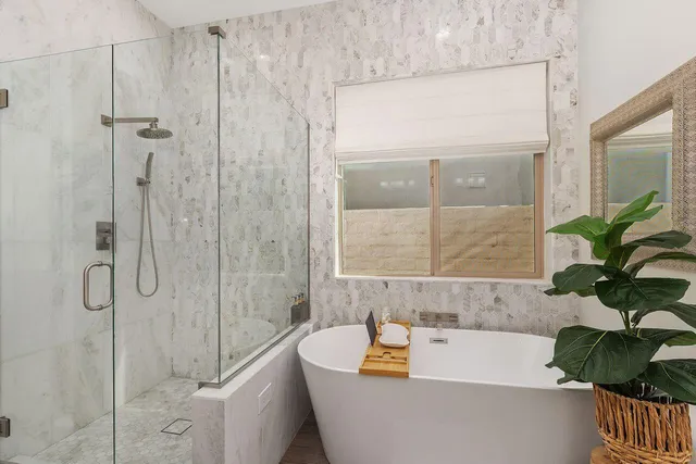 a bath tub sitting next to a window