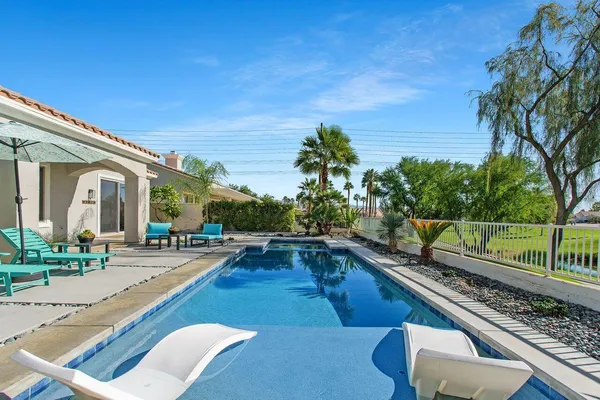a view of a swimming pool with a patio