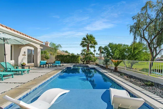 a view of a swimming pool with a patio