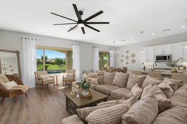 a living room with furniture and a large window