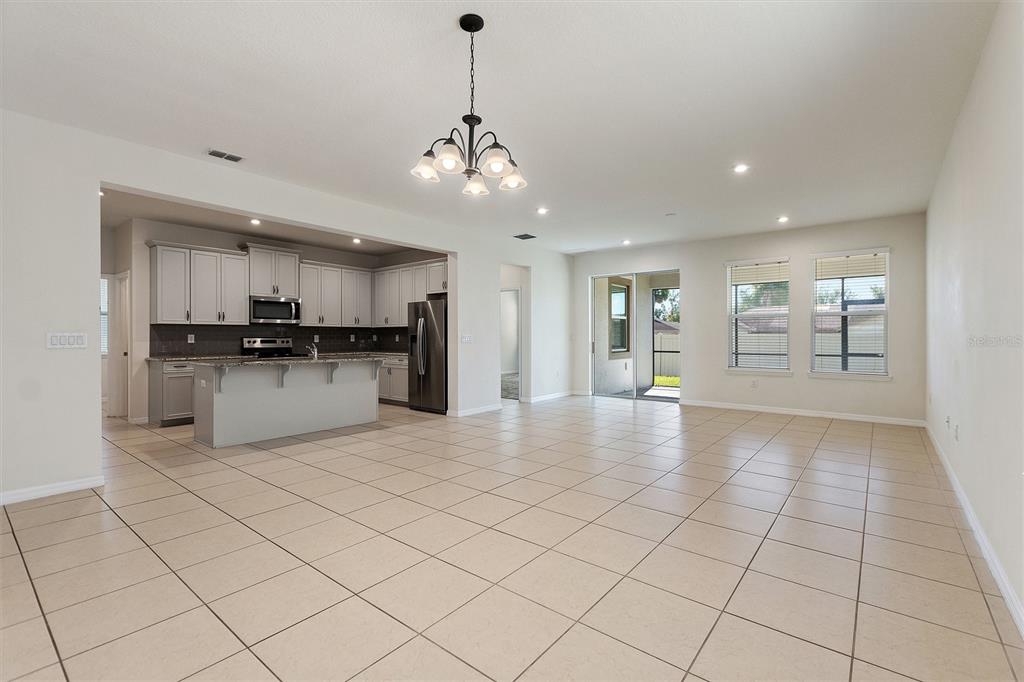 2500 Avian Loop Kissimmee, FL 34741 - Photo 11 of 35 a view of a kitchen with a sink and cabinets