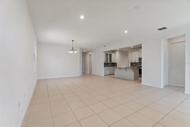 a view of a kitchen with a sink and a refrigerator