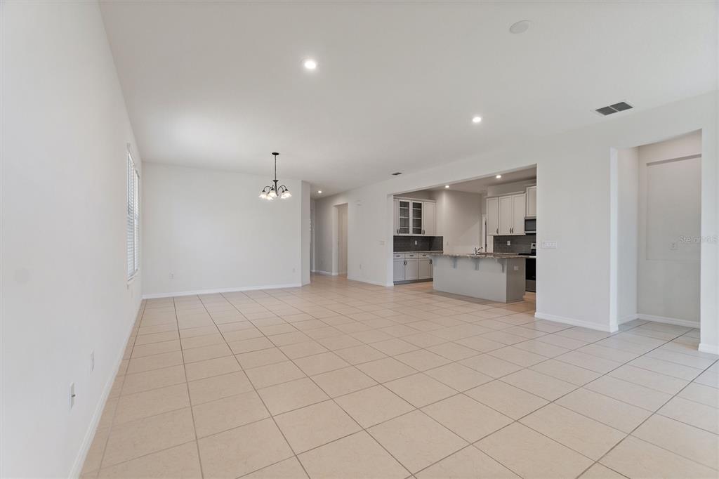 2500 Avian Loop Kissimmee, FL 34741 - Photo 13 of 35 a view of a kitchen with a sink and a refrigerator
