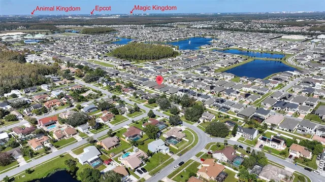 an aerial view of a house with a lake view