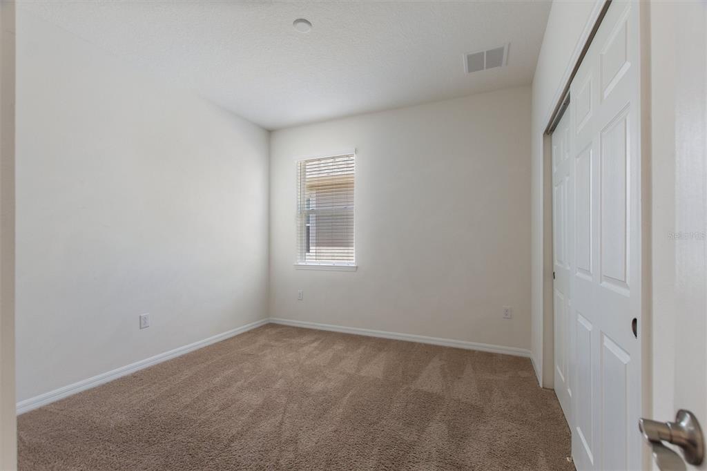 2500 Avian Loop Kissimmee, FL 34741 - Photo 6 of 35 an empty room with a window