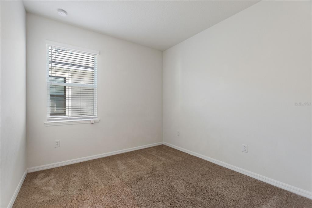 2500 Avian Loop Kissimmee, FL 34741 - Photo 8 of 35 an empty room with a window