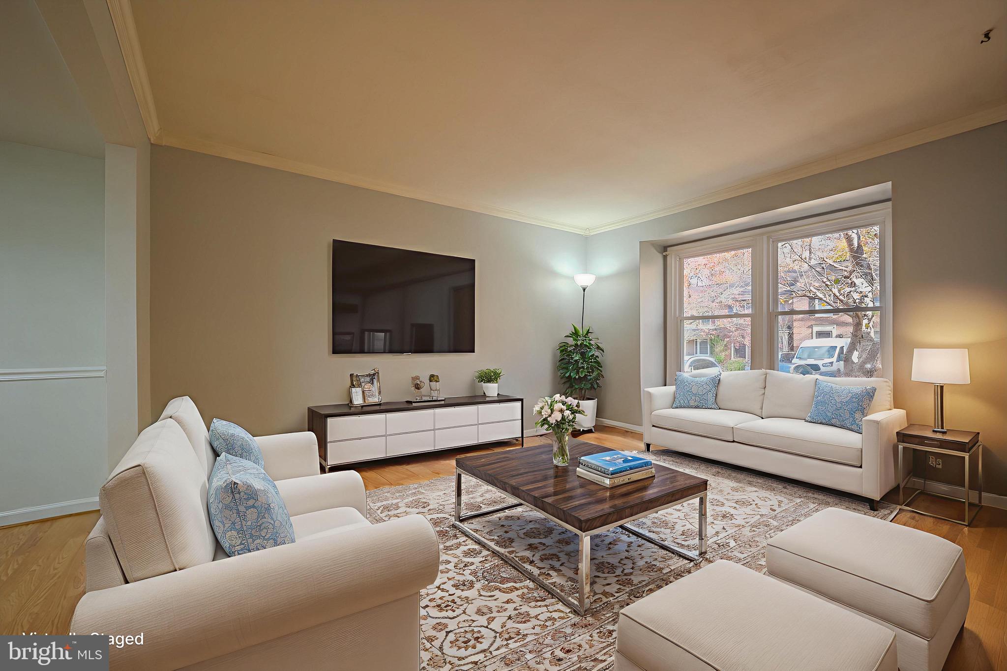 6260 Rathlin Drive Springfield, VA 22152 - Photo 2 of 11 a living room with furniture and a flat screen tv