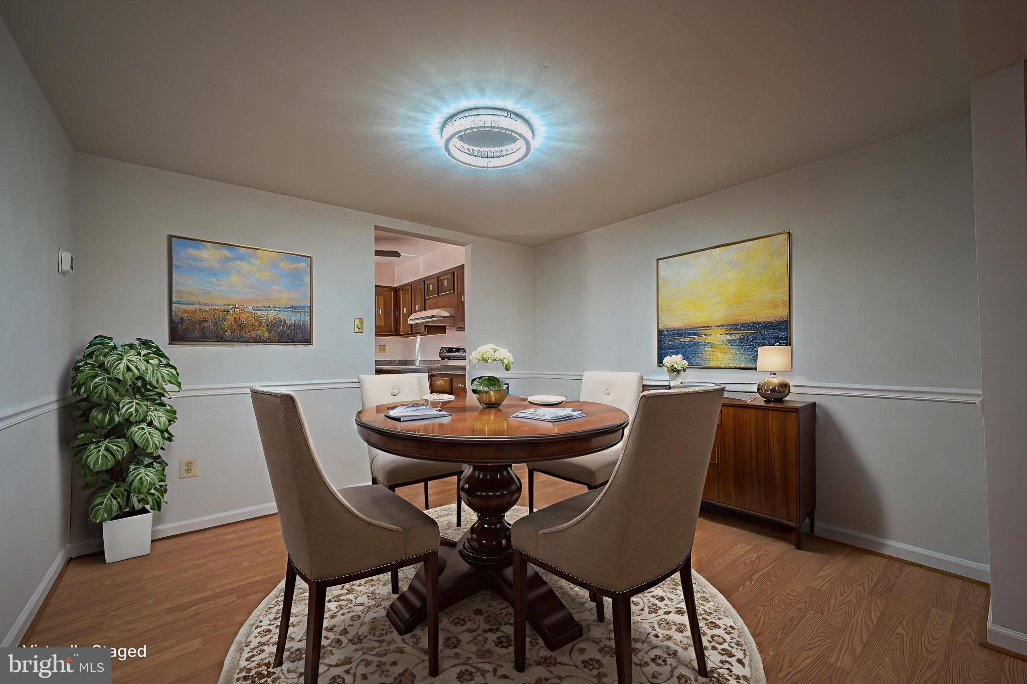 6260 Rathlin Drive Springfield, VA 22152 - Photo 3 of 11 a view of a dining room with furniture and wooden floor