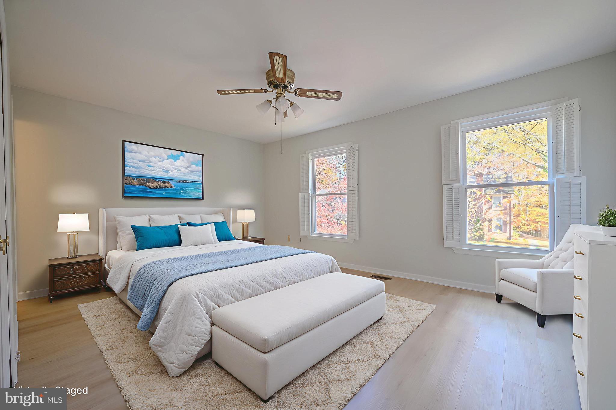 6260 Rathlin Drive Springfield, VA 22152 - Photo 6 of 11 a bedroom with a large bed couch and two window