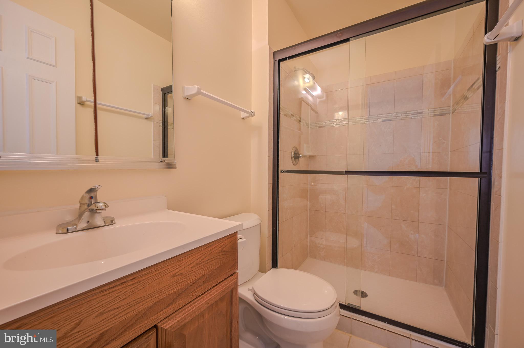 6260 Rathlin Drive Springfield, VA 22152 - Photo 7 of 11 a bathroom with a sink toilet and shower