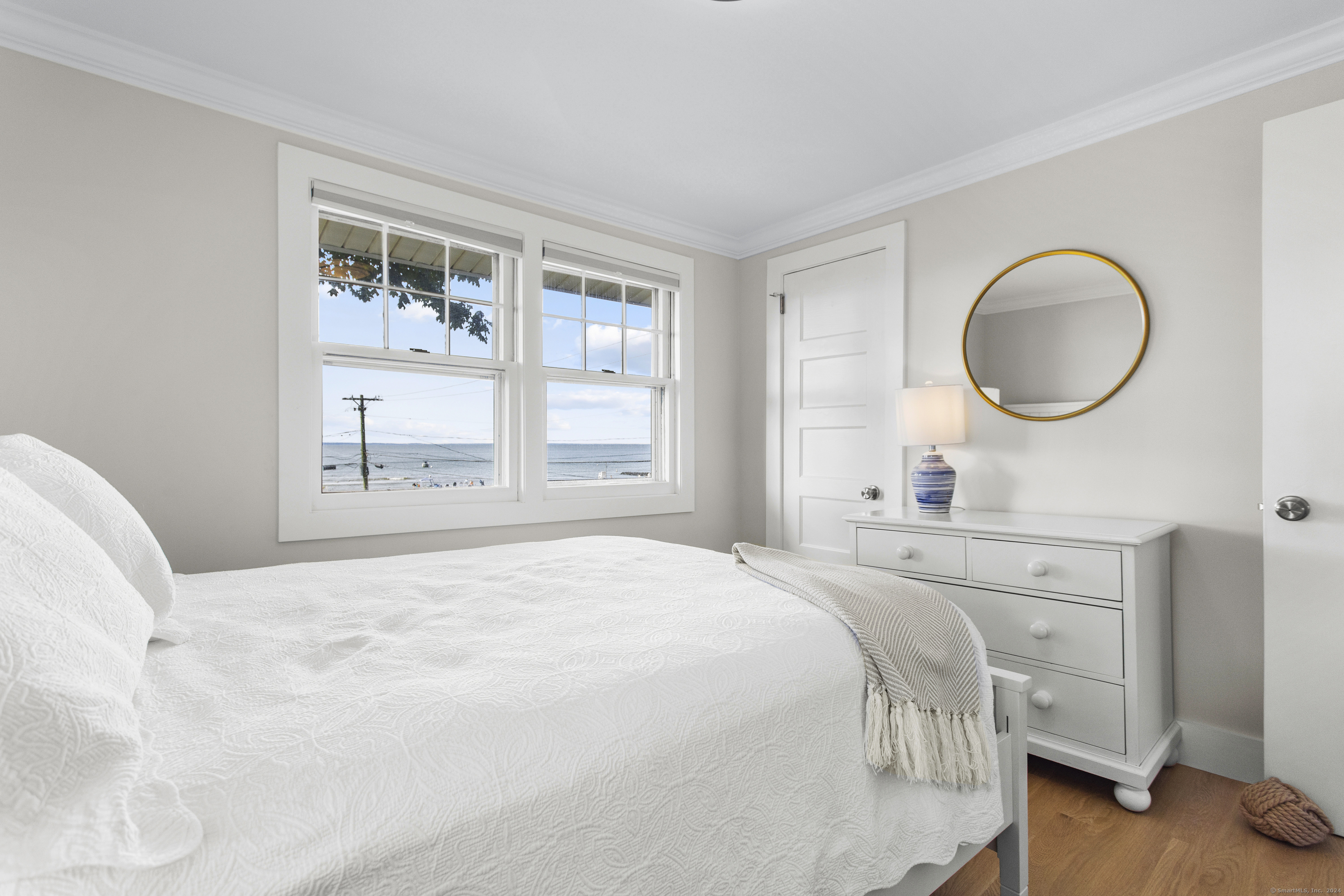15 Cottage Road Old Lyme, CT 06371 - Photo 15 of 26 a bedroom with a bed and a window