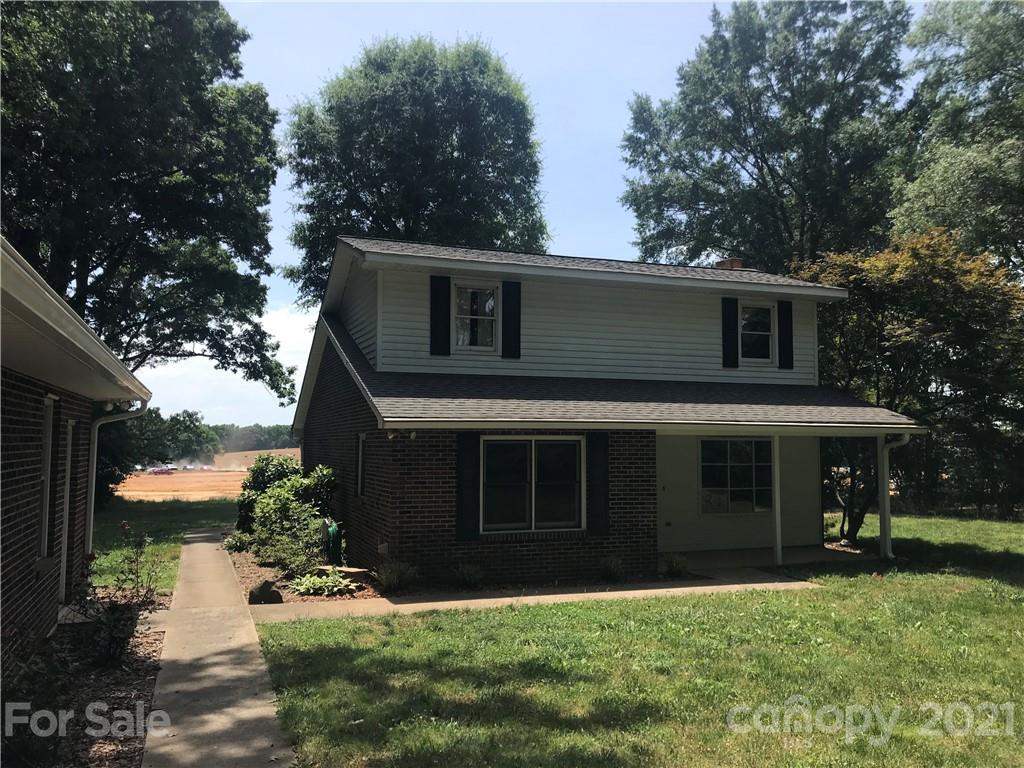 826 Potter Road Monroe, NC 28110 - Photo 2 of 20 a front view of a house with a yard and garage