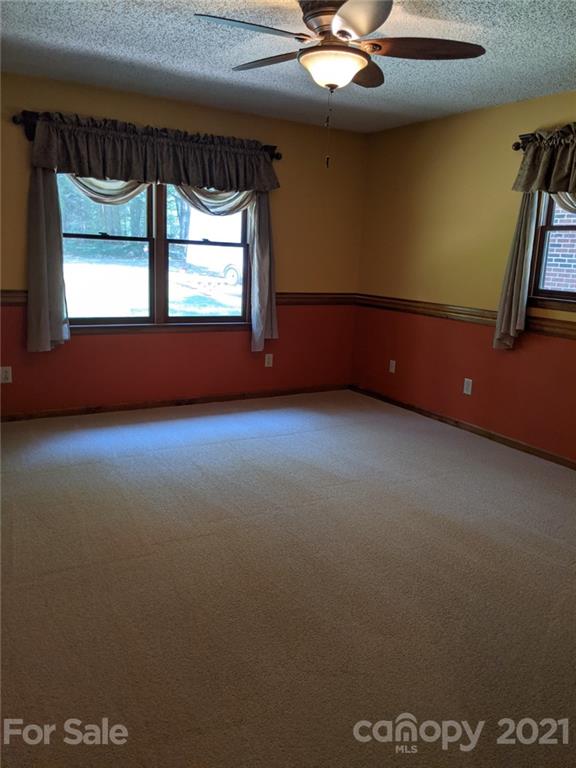 826 Potter Road Monroe, NC 28110 - Photo 12 of 20 an empty room with windows
