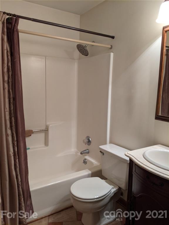 826 Potter Road Monroe, NC 28110 - Photo 15 of 20 a white toilet sitting next to a bath tub and shower
