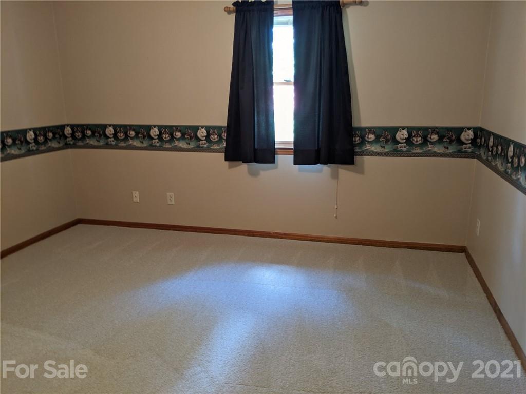 826 Potter Road Monroe, NC 28110 - Photo 17 of 20 a view of a room with window and stairs