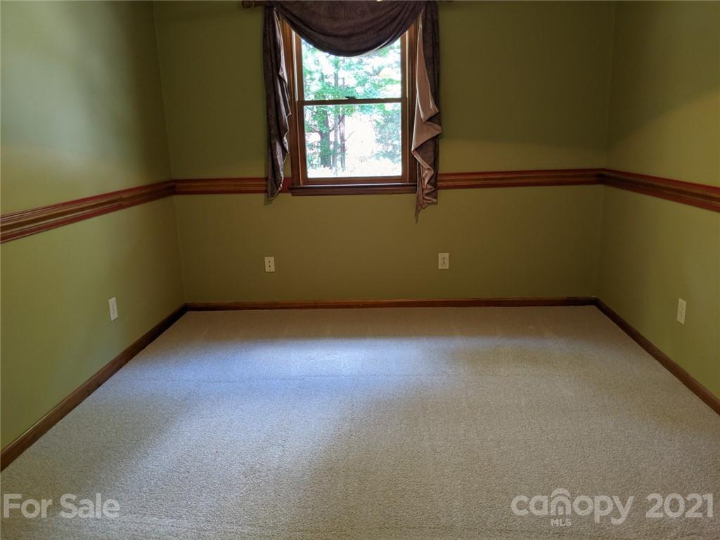 826 Potter Road Monroe, NC 28110 - Photo 20 of 20 a view of a room with a window and a ceiling fan