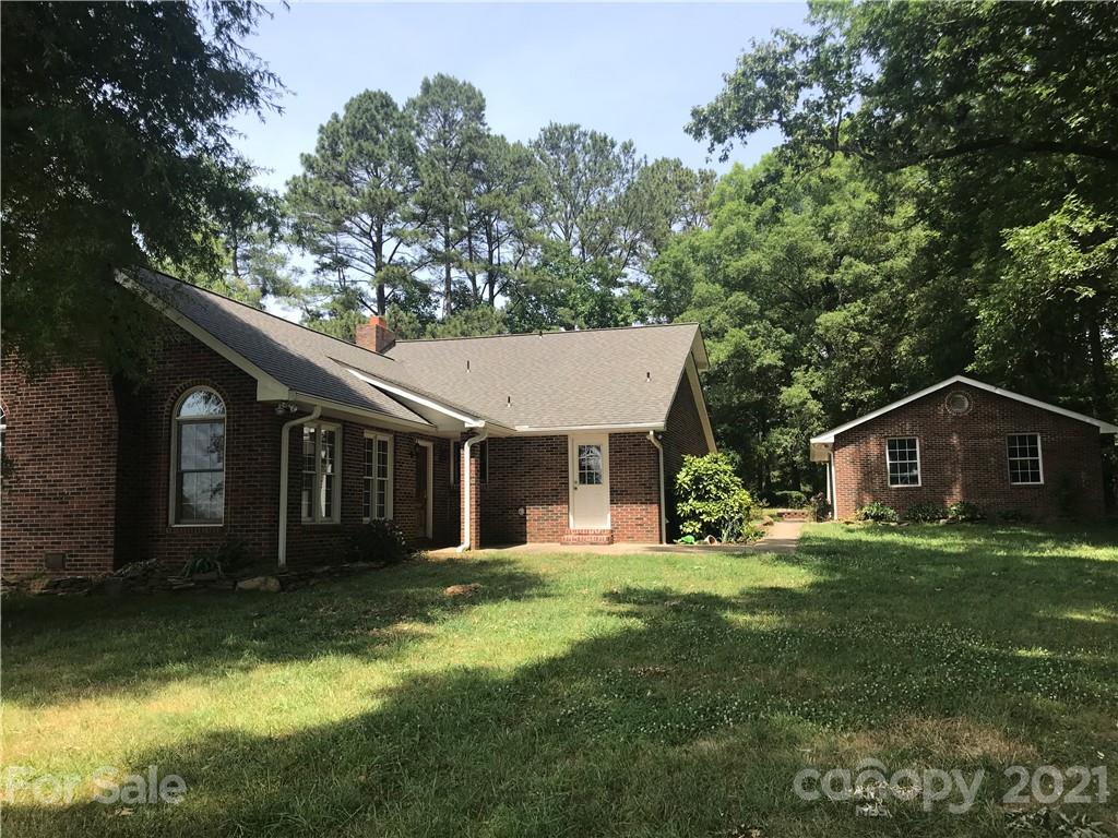 826 Potter Road Monroe, NC 28110 - Photo 4 of 20 a view of a house with a yard