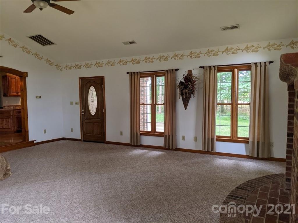 826 Potter Road Monroe, NC 28110 - Photo 6 of 20 an empty room with windows