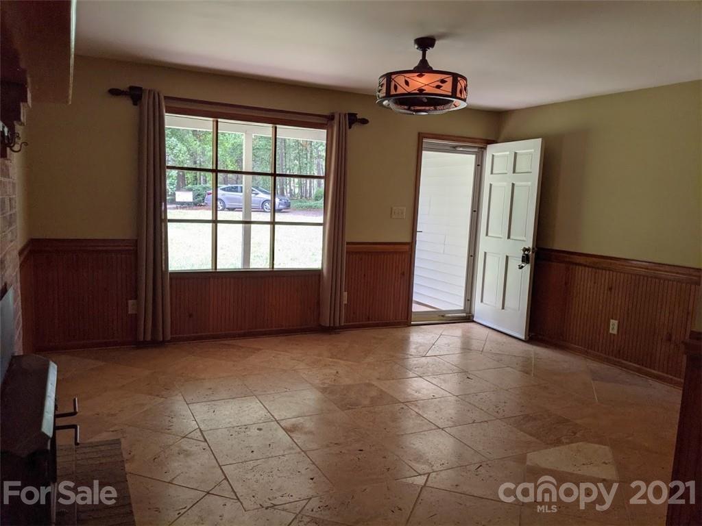 826 Potter Road Monroe, NC 28110 - Photo 7 of 20 a view of an empty room and window