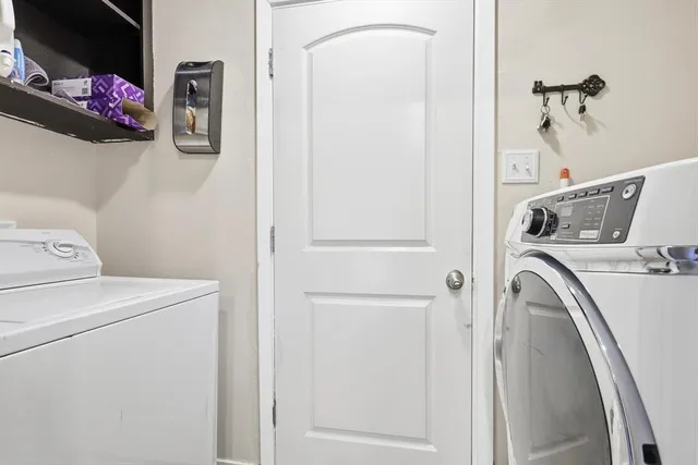 a utility room with dryer and washer