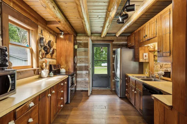 a view of a house with swimming pool and a table and chairs