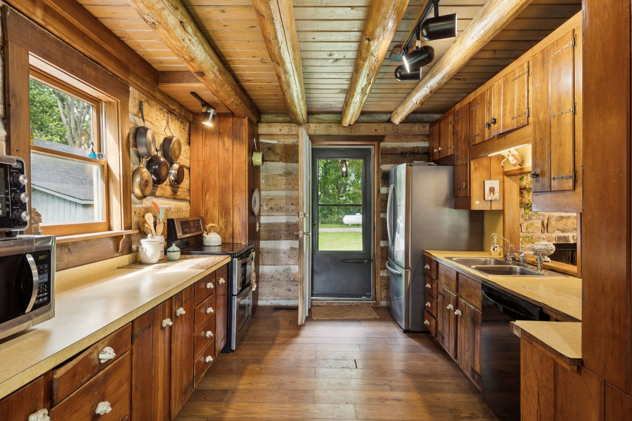 6633 Pinkston Road College Grove, TN 37046 - Photo 24 of 78 a large kitchen with stainless steel appliances granite countertop a sink stove and cabinets