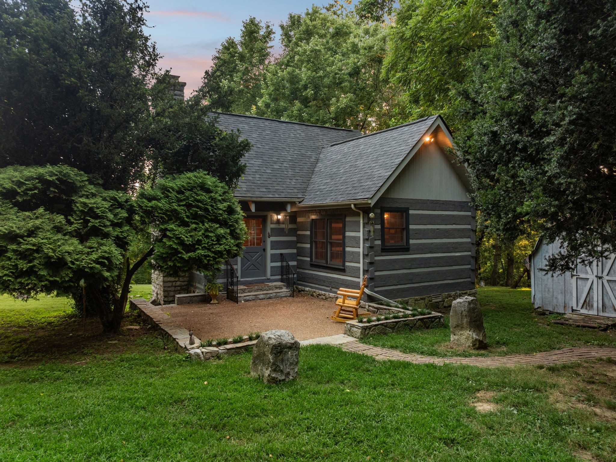 6633 Pinkston Road College Grove, TN 37046 - Photo 37 of 78 a view of backyard with a garden and trees