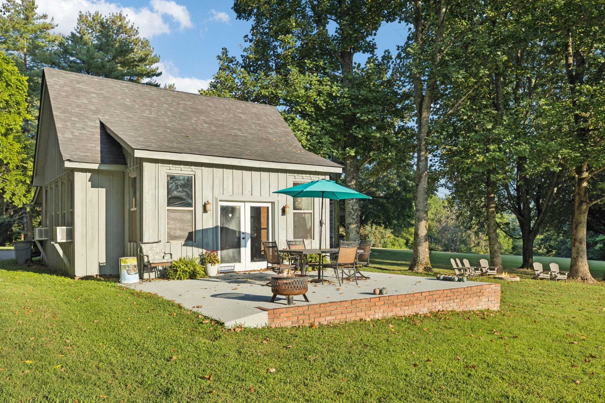 6633 Pinkston Road College Grove, TN 37046 - Photo 47 of 78 a view of a house with swimming pool and a table and chairs