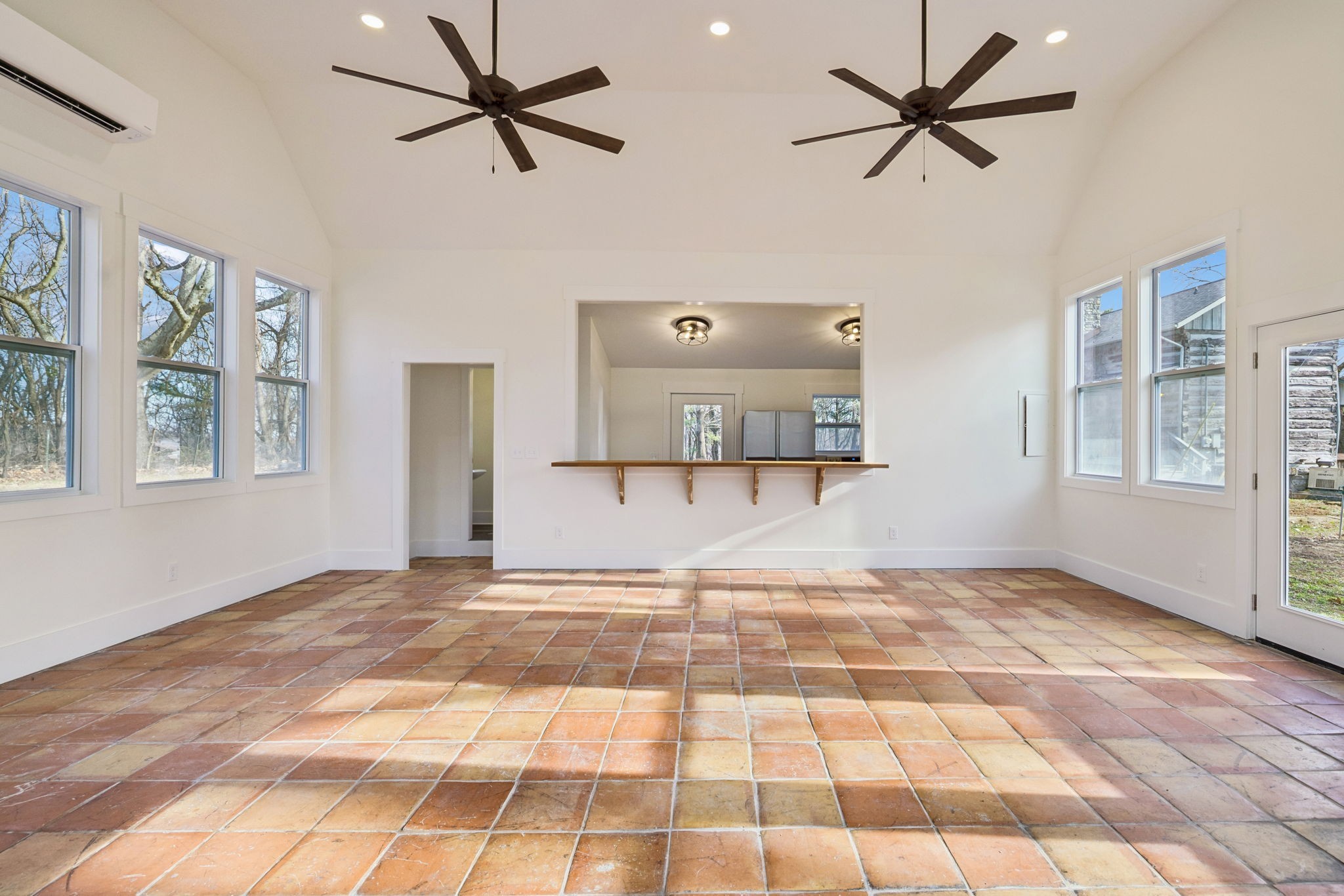 6633 Pinkston Road College Grove, TN 37046 - Photo 49 of 78 a view of a livingroom with a workspace a ceiling fan and a rug